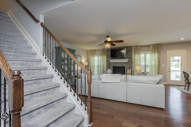 320 Manitoba Ln, Lexington, KY 40515 - living room with stairs, ceiling fan, a fireplace, wood finished floors, and baseboards