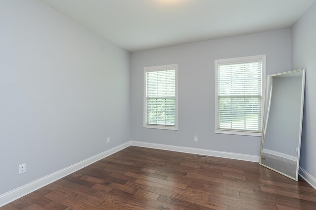 320 Manitoba Ln, Lexington, KY 40515 - spare room featuring baseboards and dark wood-type flooring