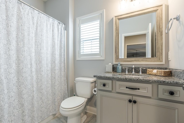 320 Manitoba Ln, Lexington, KY 40515 - bathroom featuring vanity, toilet, and baseboards
