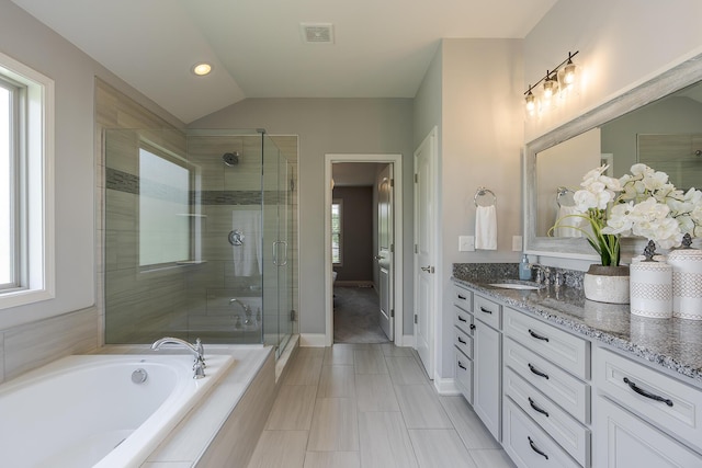 320 Manitoba Ln, Lexington, KY 40515 - bathroom featuring vanity, a shower stall, toilet, a bath, and vaulted ceiling