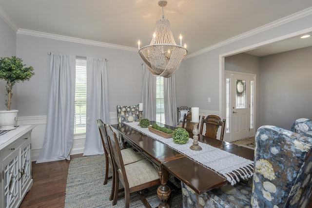 320 Manitoba Ln, Lexington, KY 40515 - dining room featuring healthy amount of natural light, a chandelier, ornamental molding, dark wood-type flooring, and wainscoting