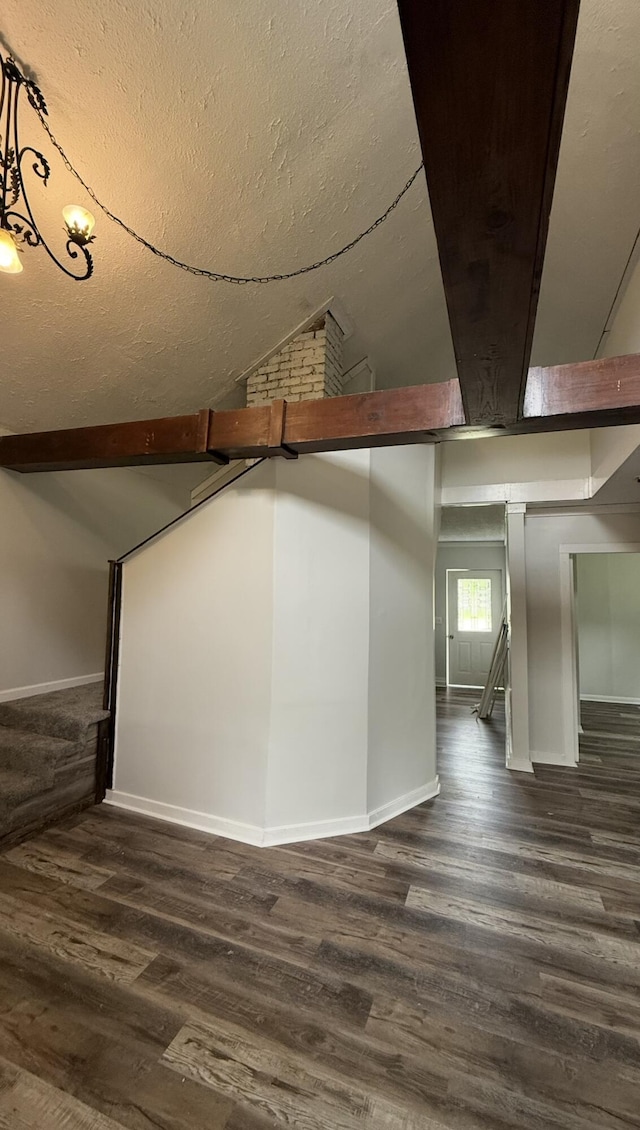 606 Prospect St, Berea, KY 40403 - below grade area with dark wood-style flooring, baseboards, and a textured ceiling