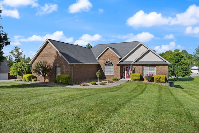 262 Silver Creek Dr, Somerset, KY 42503 - view of front of house with brick siding, a front lawn, and a shingled roof
