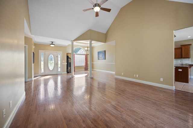 262 Silver Creek Dr, Somerset, KY 42503 - unfurnished living room with high vaulted ceiling, ceiling fan, wood finished floors, a sink, and baseboards