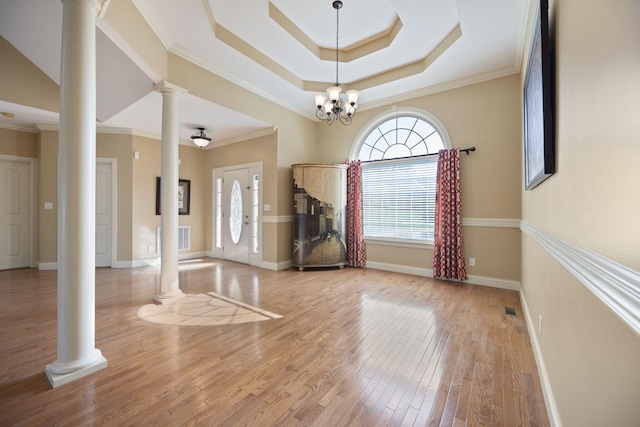 262 Silver Creek Dr, Somerset, KY 42503 - foyer entrance with decorative columns, wood finished floors, baseboards, crown molding, and a chandelier