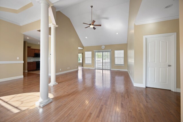 262 Silver Creek Dr, Somerset, KY 42503 - unfurnished living room featuring decorative columns, a ceiling fan, high vaulted ceiling, light wood-style flooring, and baseboards