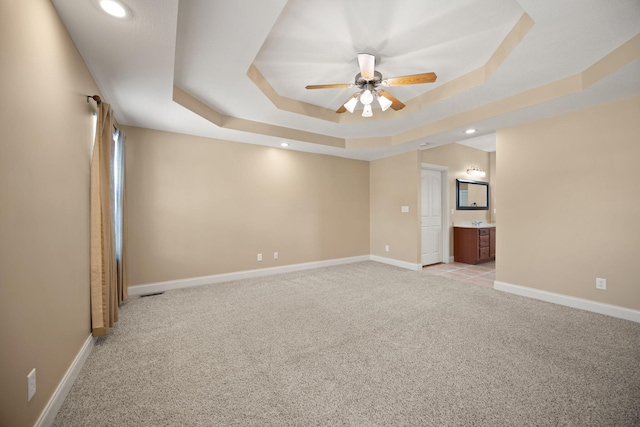 262 Silver Creek Dr, Somerset, KY 42503 - empty room with light carpet, a raised ceiling, a ceiling fan, recessed lighting, and baseboards
