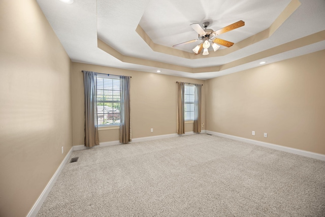 262 Silver Creek Dr, Somerset, KY 42503 - empty room featuring ceiling fan, a raised ceiling, plenty of natural light, light colored carpet, and recessed lighting