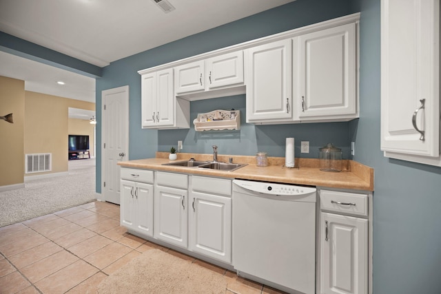 262 Silver Creek Dr, Somerset, KY 42503 - kitchen with dishwasher, a sink, white cabinets, and light colored carpet