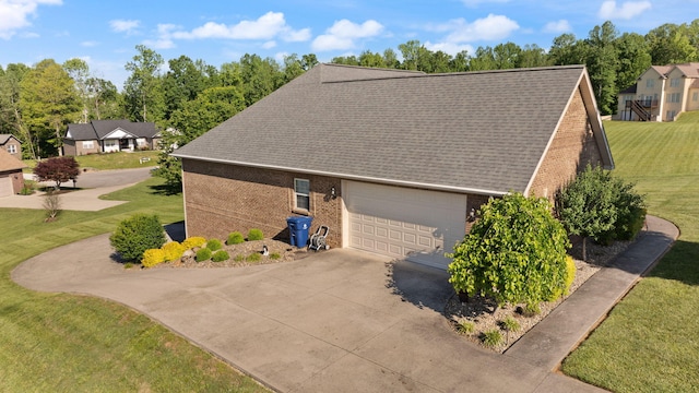 262 Silver Creek Dr, Somerset, KY 42503 - view of side of property with driveway, brick siding, an attached garage, and a lawn