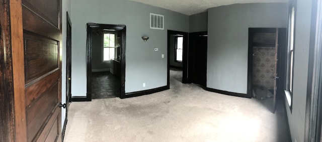 210 E 7th St, Lexington, KY 40508 - unfurnished bedroom featuring baseboards and light colored carpet