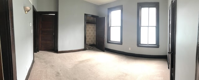 210 E 7th St, Lexington, KY 40508 - unfurnished bedroom with light colored carpet and baseboards