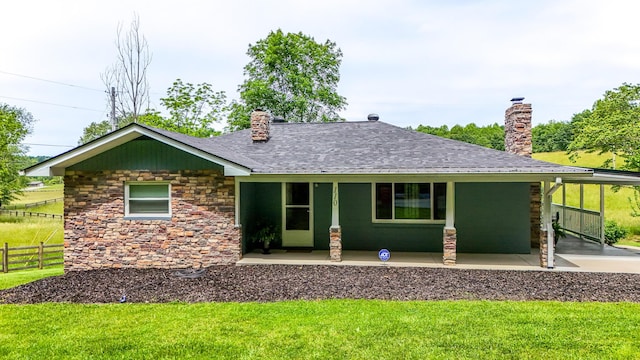 110 Witt Rd, London, KY 40741 - view of front facade featuring a chimney, stone siding, and a shingled roof