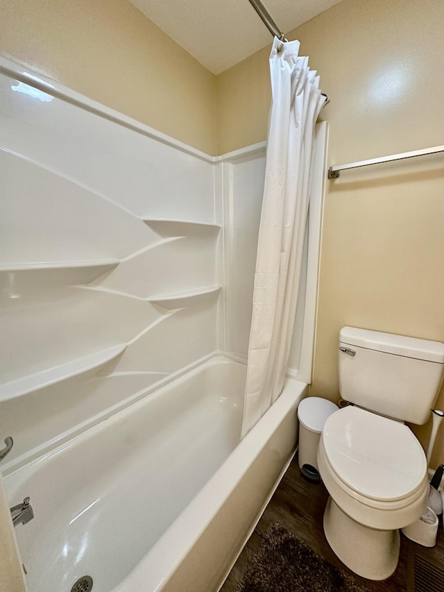 110 Witt Rd, London, KY 40741 - bathroom with toilet, shower / tub combo with curtain, and wood finished floors