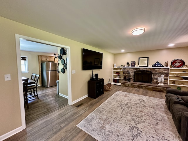 110 Witt Rd, London, KY 40741 - living room featuring dark wood-style flooring, baseboards, a fireplace, and recessed lighting