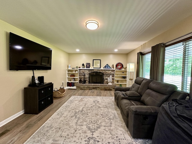 110 Witt Rd, London, KY 40741 - living room featuring wood finished floors, baseboards, and a stone fireplace