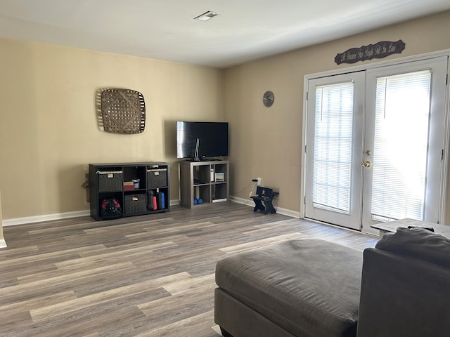1352 Deer Lake Cir, Lexington, KY 40515 - living room featuring french doors, wood finished floors, and baseboards