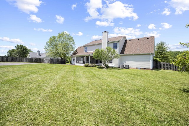 164 River Run Dr, Lancaster, KY 40444 - rear view of house with a sunroom, a chimney, roof with shingles, and cooling unit
