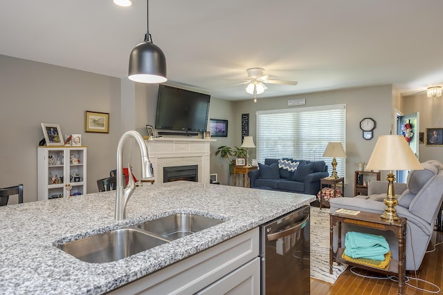 395 Redding Rd Unit 19, Lexington, KY 40517 - kitchen with stainless steel dishwasher, a sink, open floor plan, wood finished floors, and ceiling fan