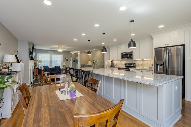 395 Redding Rd Unit 19, Lexington, KY 40517 - dining space featuring a ceiling fan, recessed lighting, and wood finished floors