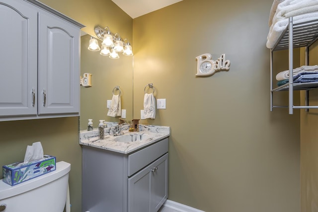 395 Redding Rd Unit 19, Lexington, KY 40517 - bathroom featuring toilet, vanity, and baseboards