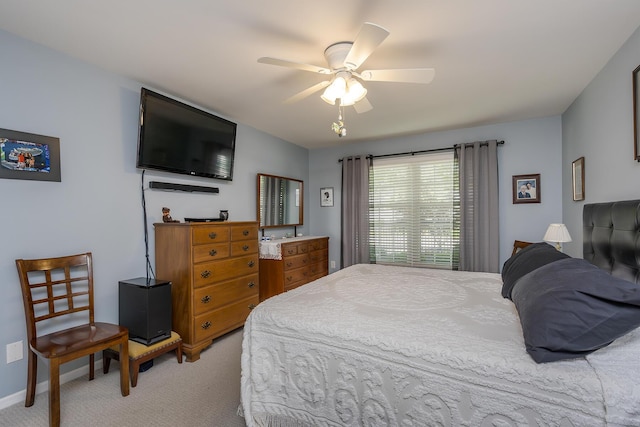 395 Redding Rd Unit 19, Lexington, KY 40517 - bedroom featuring light carpet, a ceiling fan, and baseboards