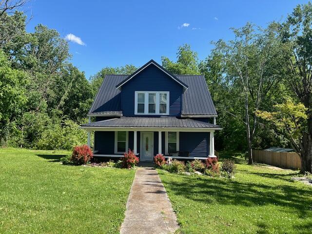 505 Burkesville St, Columbia, KY 42728 - view of front of home with a porch and metal roof