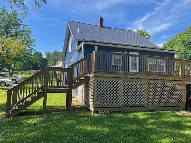 505 Burkesville St, Columbia, KY 42728 - back of house with stairway, a chimney, a lawn, and a wooden deck