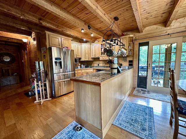5080 Dry Branch Rd, Lexington, KY 40515 - kitchen with stainless steel fridge, wooden ceiling with exposed beams, light wood-type flooring, light brown cabinetry, and a peninsula