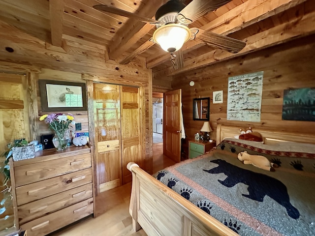 5080 Dry Branch Rd, Lexington, KY 40515 - bedroom featuring wooden walls, light wood finished floors, and wood ceiling with exposed beams