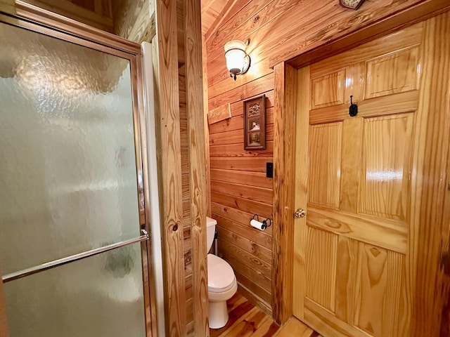 5080 Dry Branch Rd, Lexington, KY 40515 - bathroom featuring toilet, wood walls, an enclosed shower, and wood finished floors
