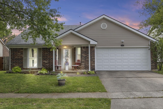 3453 Colonnade Dr, Lexington, KY 40515 - single story home featuring brick siding, driveway, a yard, an attached garage, and roof with shingles