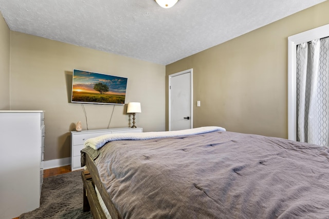 112 Gano Ave, Georgetown, KY 40324 - bedroom with wood finished floors, a textured ceiling, and baseboards