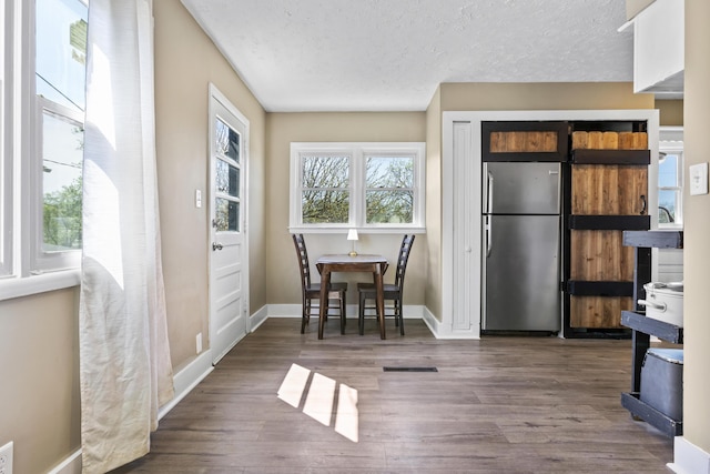 112 Gano Ave, Georgetown, KY 40324 - dining room with wood finished floors, baseboards, and a textured ceiling