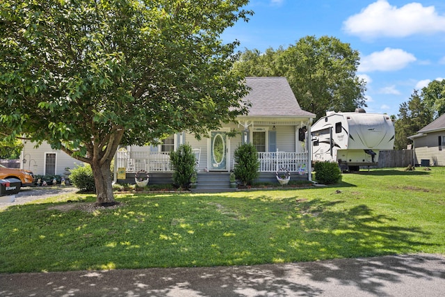 81 Coffey Ave, Jamestown, KY 42629 - view of front of house with a porch, a front lawn, and a shingled roof