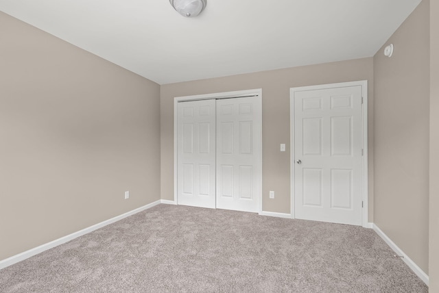 306 Young St, Georgetown, KY 40324 - unfurnished bedroom featuring carpet flooring, a closet, and baseboards