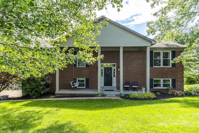 2018 E Ct, Richmond, KY 40475 - bi-level home with brick siding, a front lawn, and a porch