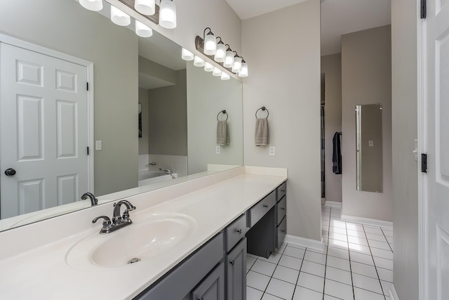 2018 E Ct, Richmond, KY 40475 - full bathroom with tile patterned flooring, vanity, a garden tub, and baseboards