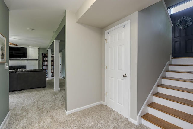 2018 E Ct, Richmond, KY 40475 - stairway with carpet, a brick fireplace, and baseboards