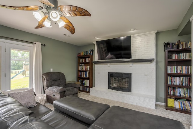 2018 E Ct, Richmond, KY 40475 - living area featuring carpet flooring, ceiling fan, and a brick fireplace