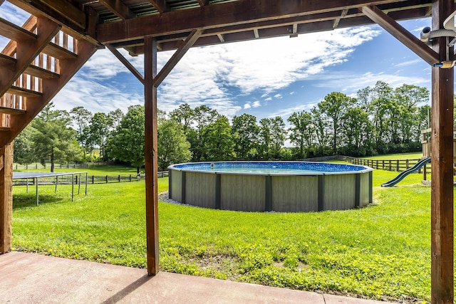 2018 E Ct, Richmond, KY 40475 - view of yard with an outdoor pool, a trampoline, and view of scattered trees