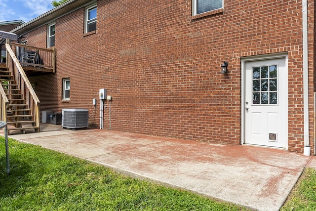 2018 E Ct, Richmond, KY 40475 - back of property with central air condition unit, stairs, brick siding, a deck, and a patio