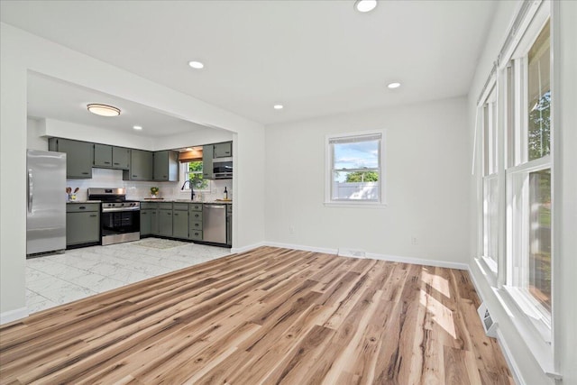 161 Toronto Rd, Lexington, KY 40515 - kitchen with stainless steel appliances, gray cabinets, a sink, light wood-style flooring, and recessed lighting