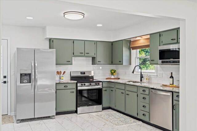161 Toronto Rd, Lexington, KY 40515 - kitchen with appliances with stainless steel finishes, green cabinets, and light stone countertops