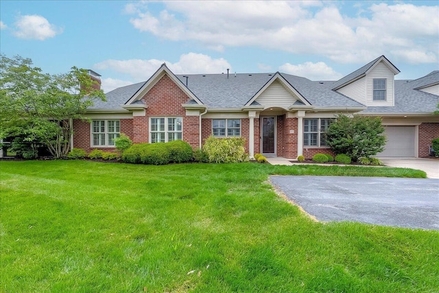 4172 Tradition Way, Lexington, KY 40509 - view of front of house featuring brick siding, a chimney, and a front yard
