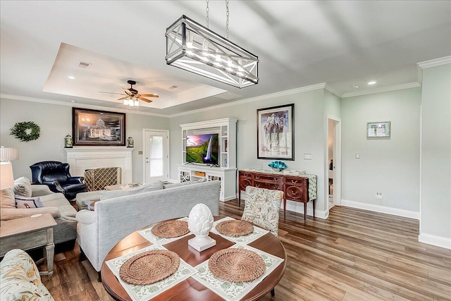 4172 Tradition Way, Lexington, KY 40509 - dining room featuring wood finished floors, baseboards, crown molding, a tray ceiling, and recessed lighting