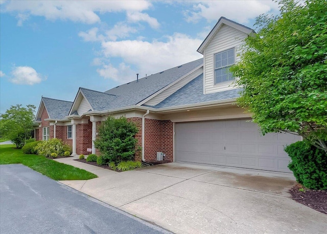 4172 Tradition Way, Lexington, KY 40509 - view of front facade with brick siding, concrete driveway, and roof with shingles