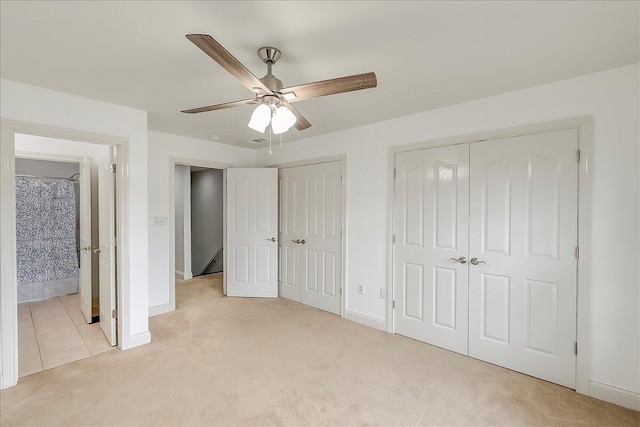 4172 Tradition Way, Lexington, KY 40509 - unfurnished bedroom featuring multiple closets, light colored carpet, and baseboards