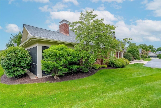 4172 Tradition Way, Lexington, KY 40509 - view of home's exterior with a yard, a sunroom, and a chimney