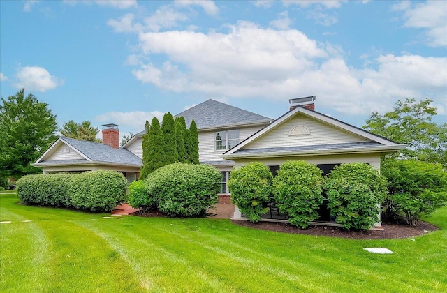 4172 Tradition Way, Lexington, KY 40509 - view of front facade featuring a front yard and a chimney
